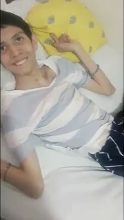 Manuel resting and smiling at the camera.
